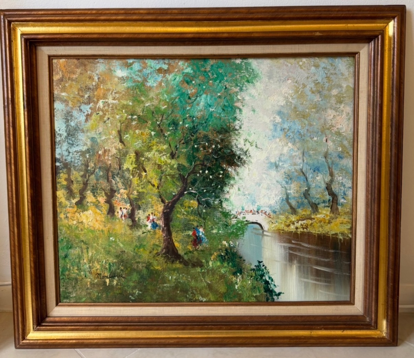 Impressionist oil painting of blossoming trees along a river with figures on a bridge
